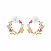 Elegant pink flower stud earrings with gold plating, adorned with opal and cubic zirconia butterfly accents.